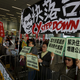 Protesters demanding better social welfare urge Hong Kong chief executive Leung Chun-ying to step down in a Jan. 2016 protest. “Build more public housing” their signs say.